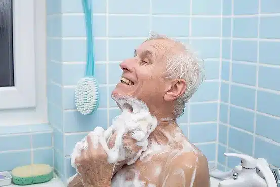 Elderly man taking a bath